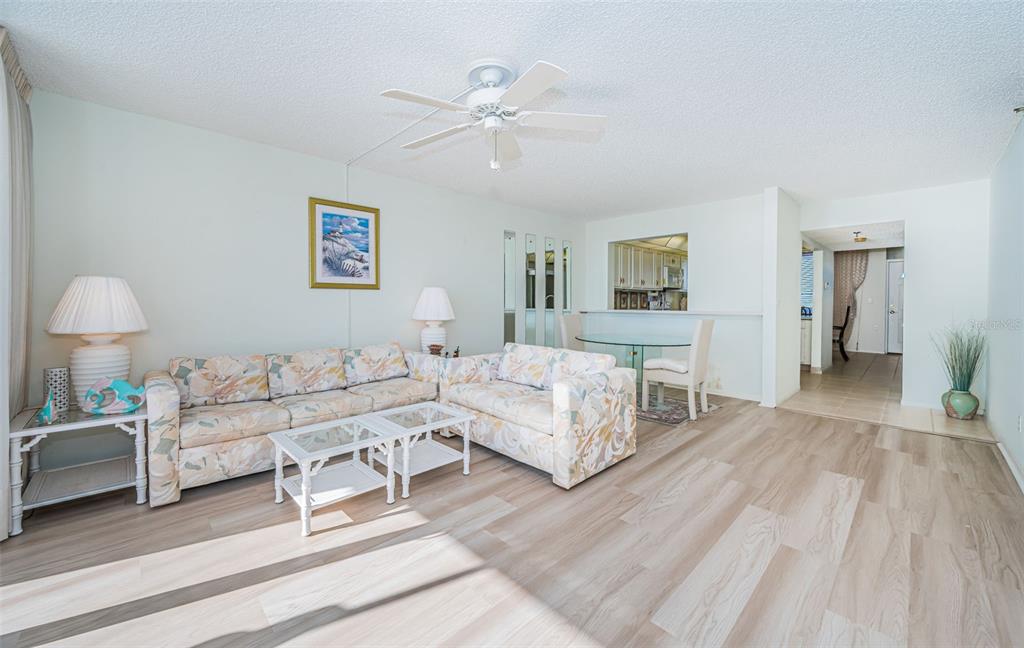 17940 Gulf Boulevard, Unit 7B Redington Shores, FL 33708 - Photo 16 of 58 a spacious bedroom with a bed and a lamp
