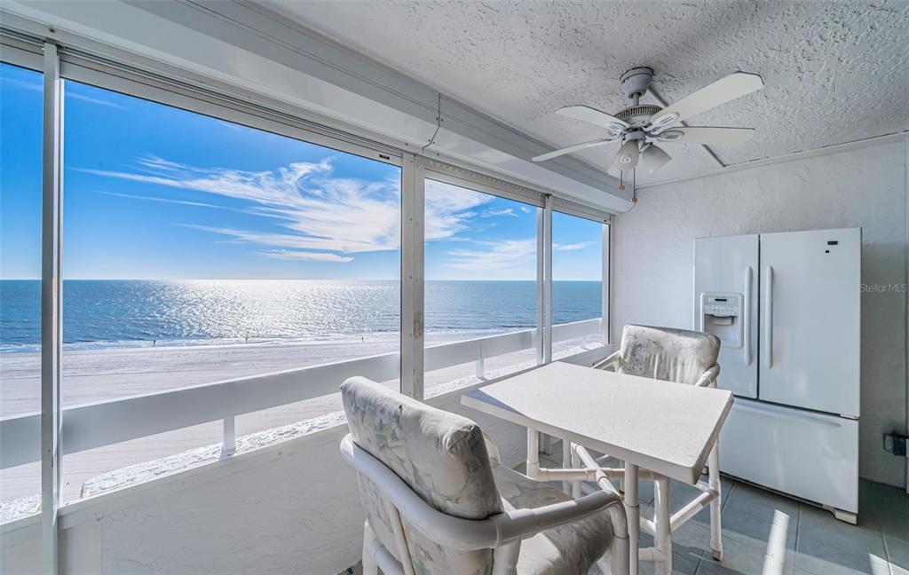 17940 Gulf Boulevard, Unit 7B Redington Shores, FL 33708 - Photo 24 of 58 a view of a dining room with furniture window and wooden floor