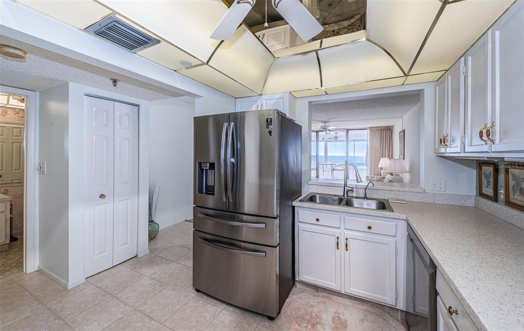 17940 Gulf Boulevard, Unit 7B Redington Shores, FL 33708 - Photo 31 of 58 a kitchen with stainless steel appliances granite countertop a refrigerator and a sink