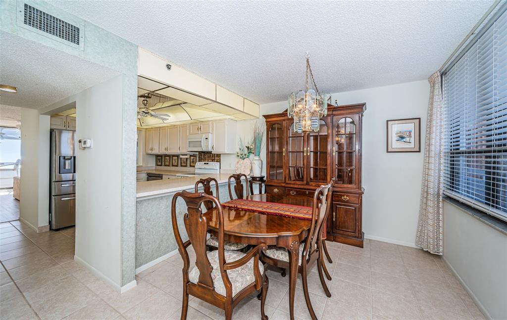 17940 Gulf Boulevard, Unit 7B Redington Shores, FL 33708 - Photo 33 of 58 a dining room with furniture and window