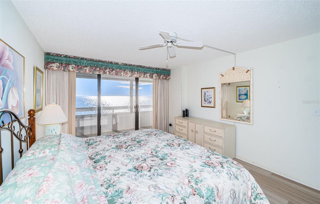 17940 Gulf Boulevard, Unit 7B Redington Shores, FL 33708 - Photo 35 of 58 a bedroom with a large bed and a large window