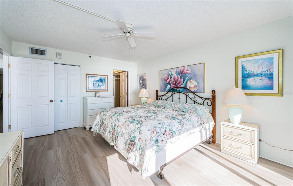 17940 Gulf Boulevard, Unit 7B Redington Shores, FL 33708 - Photo 36 of 58 a bedroom with a bed and a chandelier