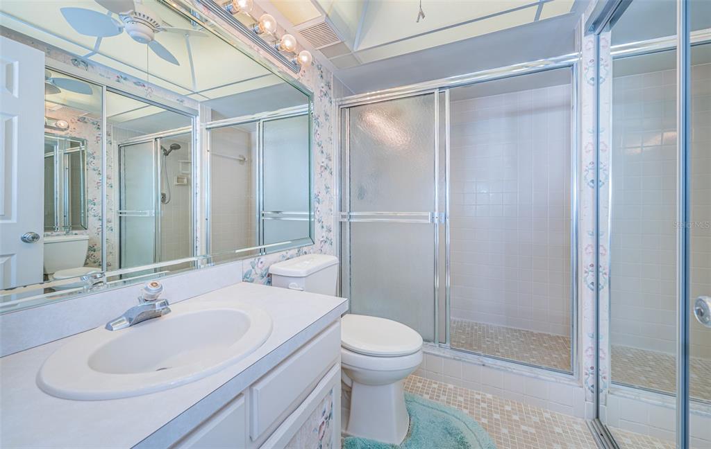 17940 Gulf Boulevard, Unit 7B Redington Shores, FL 33708 - Photo 37 of 58 a bathroom with a sink toilet and shower