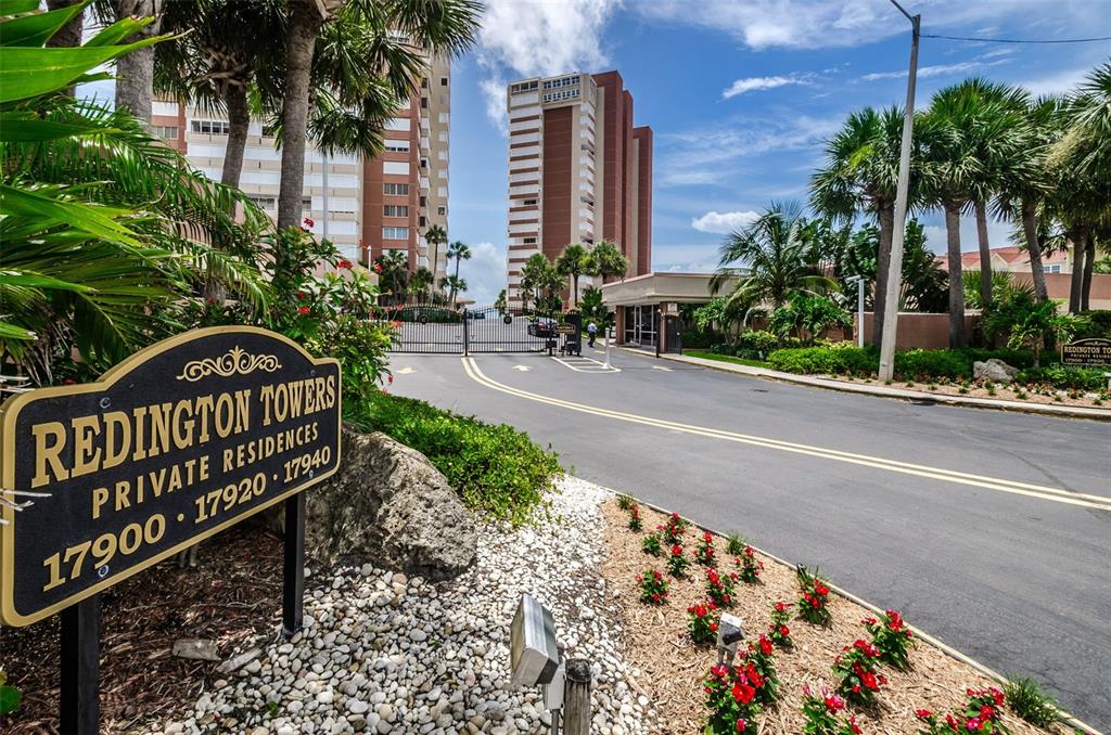 17940 Gulf Boulevard, Unit 7B Redington Shores, FL 33708 - Photo 52 of 58 a view of a wooden bench in front of a house