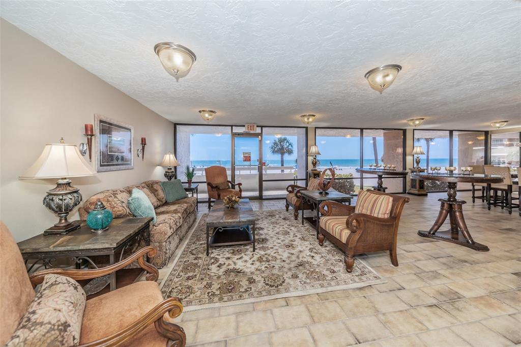 17940 Gulf Boulevard, Unit 7B Redington Shores, FL 33708 - Photo 9 of 58 a living room with furniture kitchen view and a table