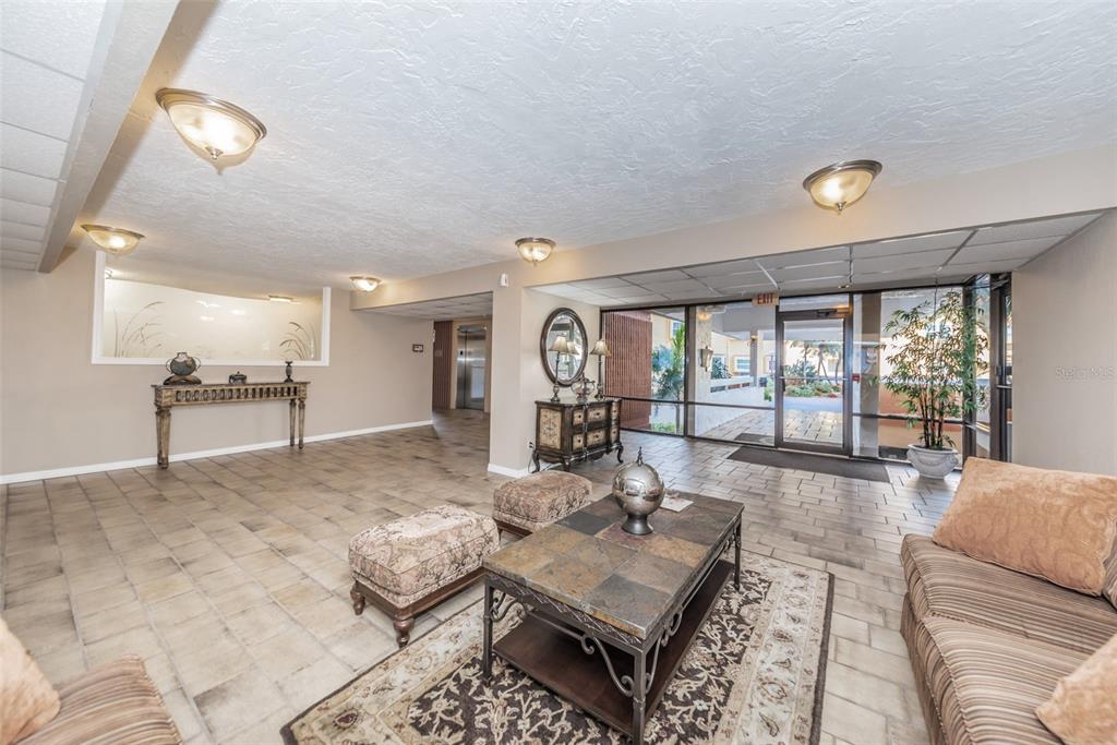 17940 Gulf Boulevard, Unit 7B Redington Shores, FL 33708 - Photo 10 of 58 a living room with furniture and a large window