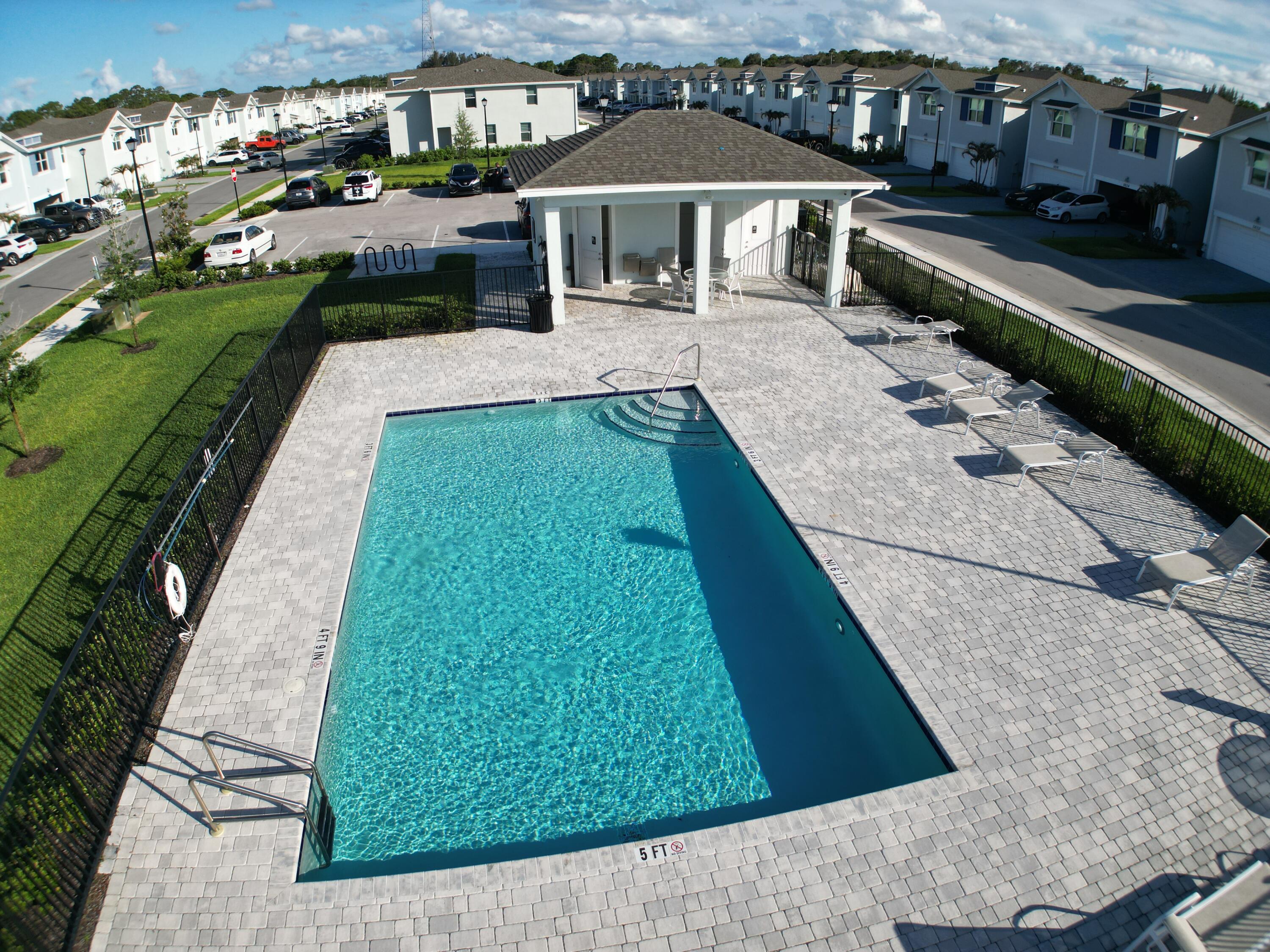 5784 Southeast Edgewater Circle Stuart, FL 34997 - Photo 32 of 33 a house view with a garden space