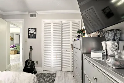 a bathroom with a granite countertop sink a toilet and shower