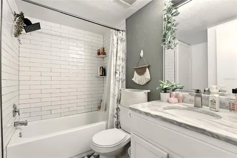 a view of living room with furniture and white walls