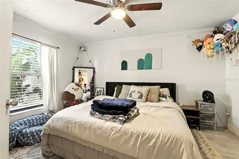 a bathroom with a granite countertop sink a toilet and a mirror