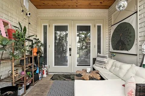 a view of a patio with a table and chairs