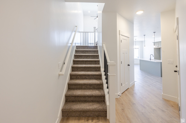 4752 Heartwood Road, Unit 433 Mapleton, UT 84664 - Photo 12 of 20 Stairway featuring wood finished floors and recessed lighting