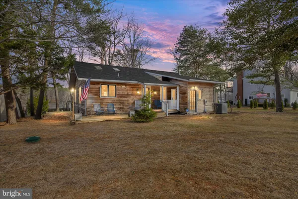 a front view of a house with wooden floor