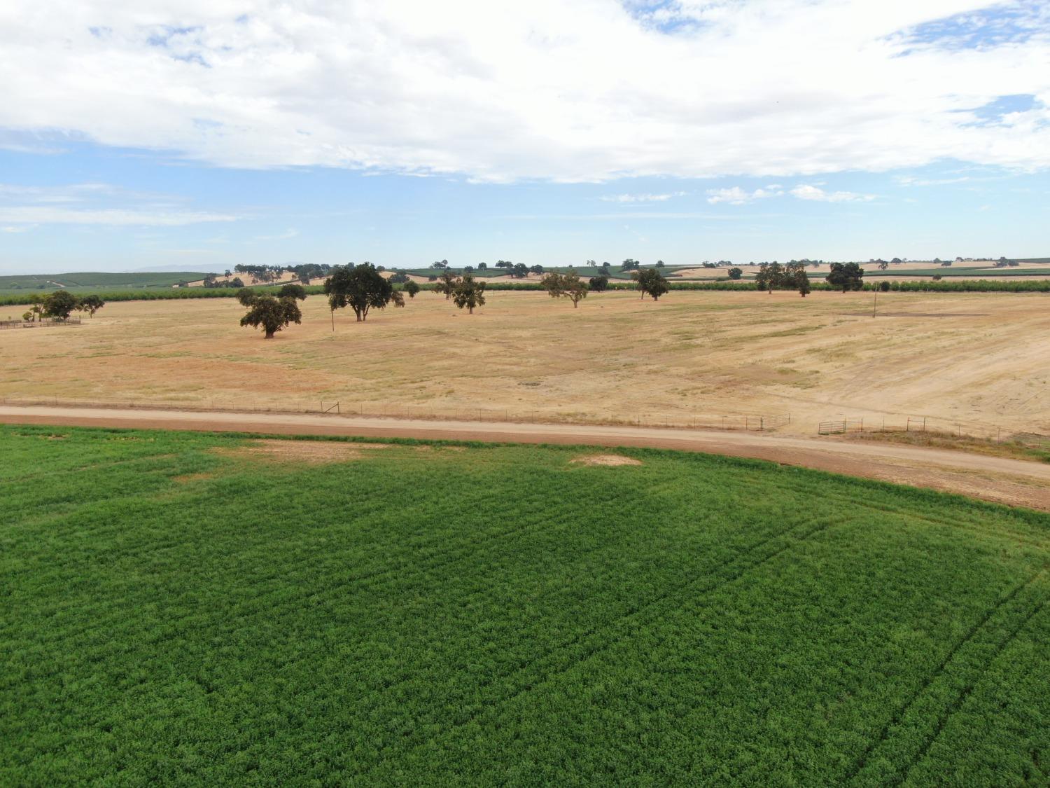 14517 East Prouty Road Galt, CA 95632 - Photo 12 of 12 a view of a lake with houses in the back