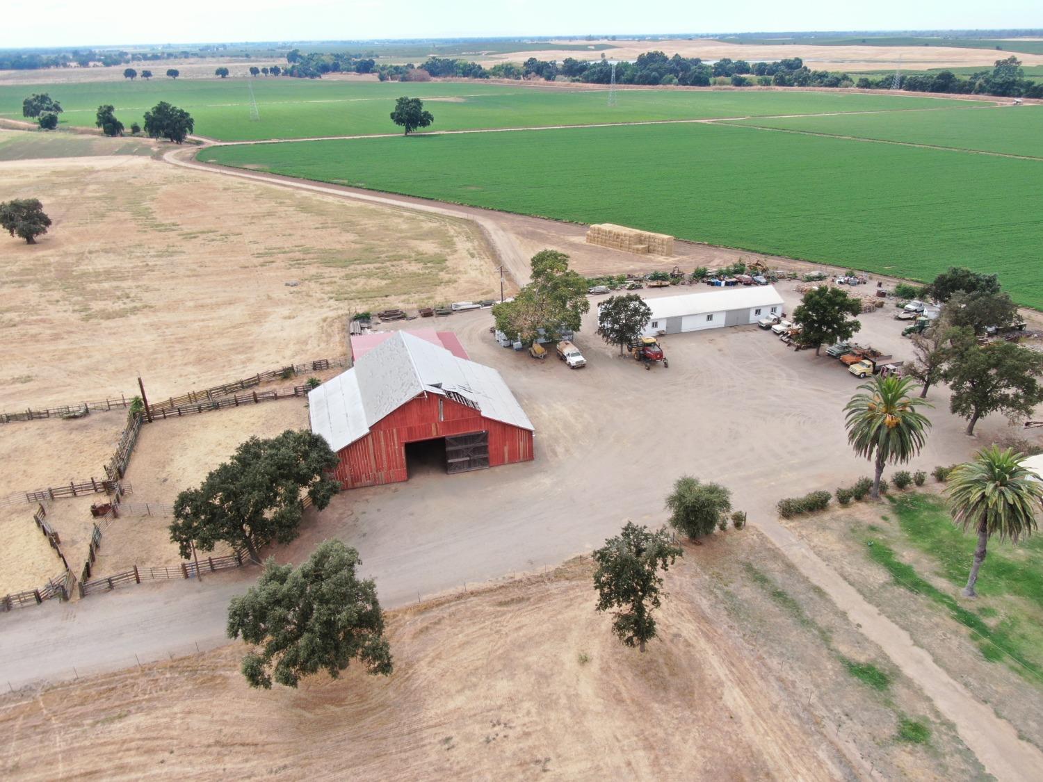 14517 East Prouty Road Galt, CA 95632 - Photo 4 of 12 an aerial view of a house with a garden and lake view