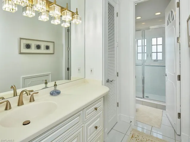 a bathroom with a sink vanity and a mirror