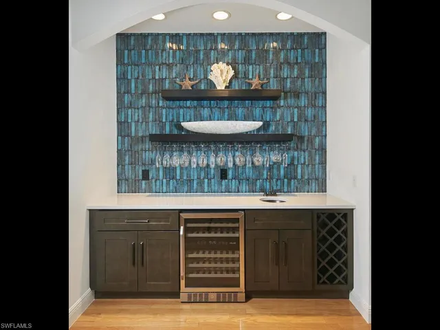 a room with a sink and a mirror