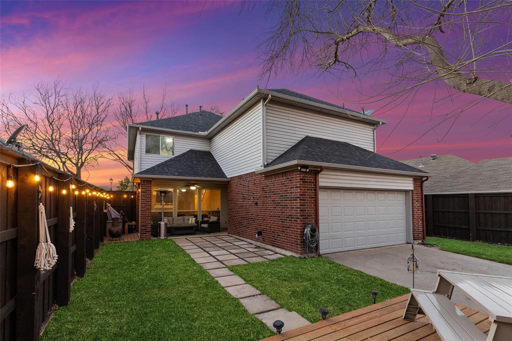 18212 Muir Circle Dallas, TX 75287 - Photo 2 of 13 a front view of a house with a yard