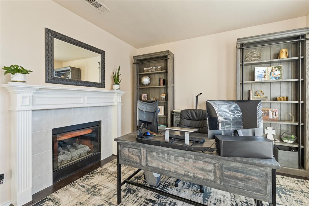 18212 Muir Circle Dallas, TX 75287 - Photo 3 of 13 a living room with furniture and a fireplace
