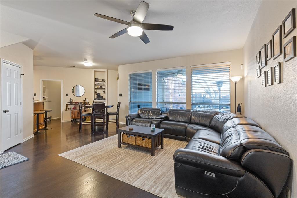 18212 Muir Circle Dallas, TX 75287 - Photo 5 of 13 a living room with furniture wooden floor and a ceiling fan