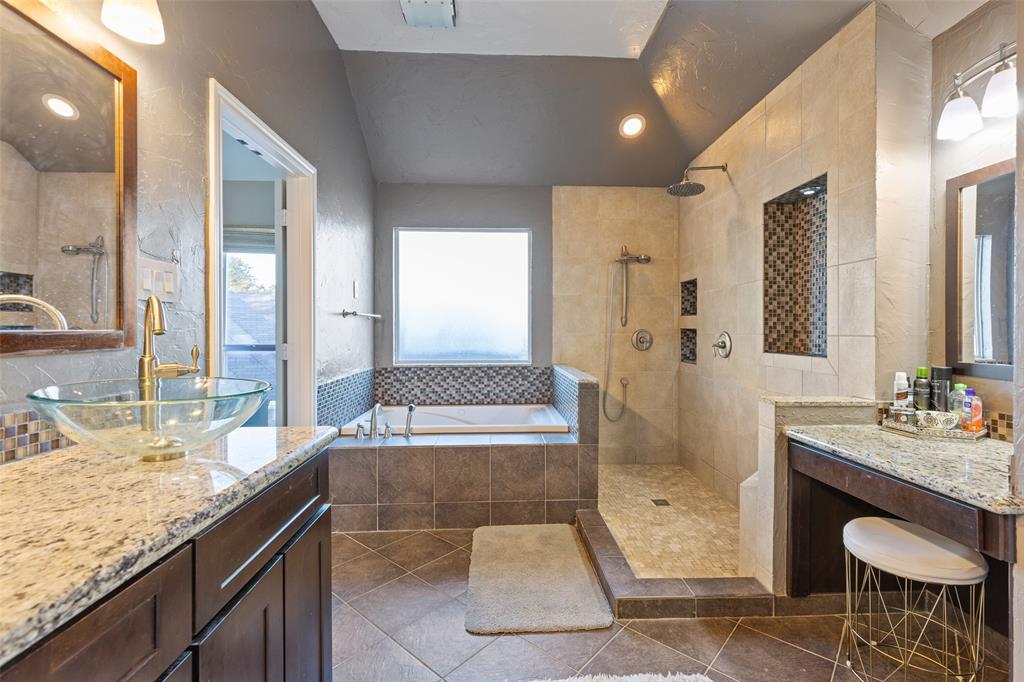 18212 Muir Circle Dallas, TX 75287 - Photo 8 of 13 a spacious bathroom with a granite countertop tub sink and mirror