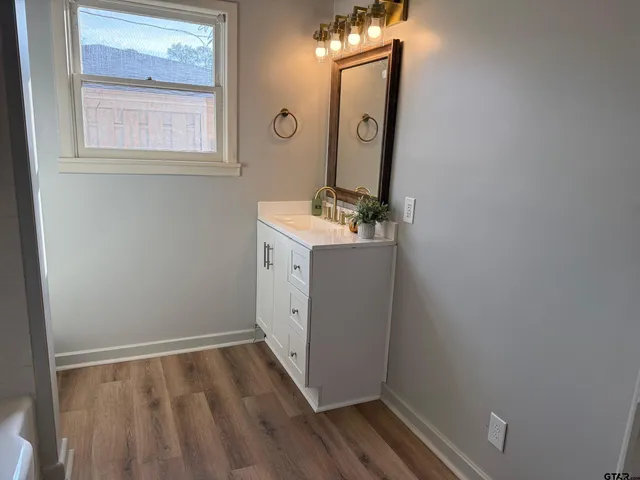a bath room with a toilet and a bath tub