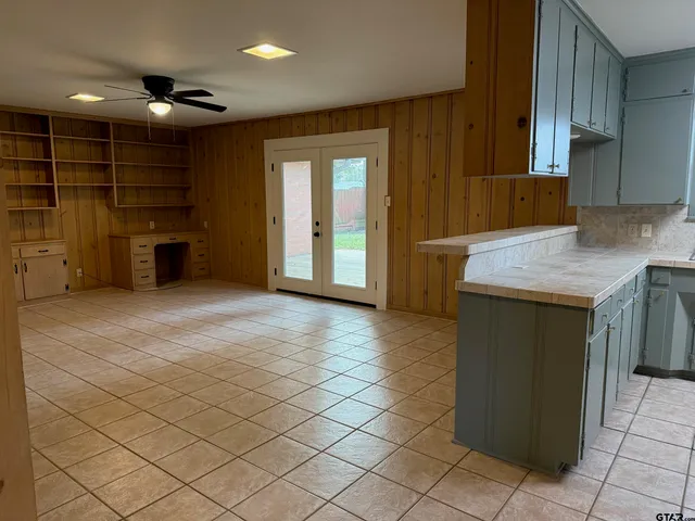 a kitchen with a sink a stove and a refrigerator