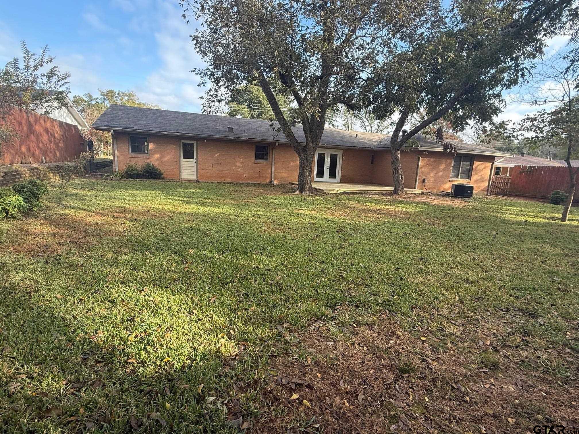 301 Ridgecrest Drive Tyler, TX 75701 - Photo 25 of 27 a front view of a house with a garden