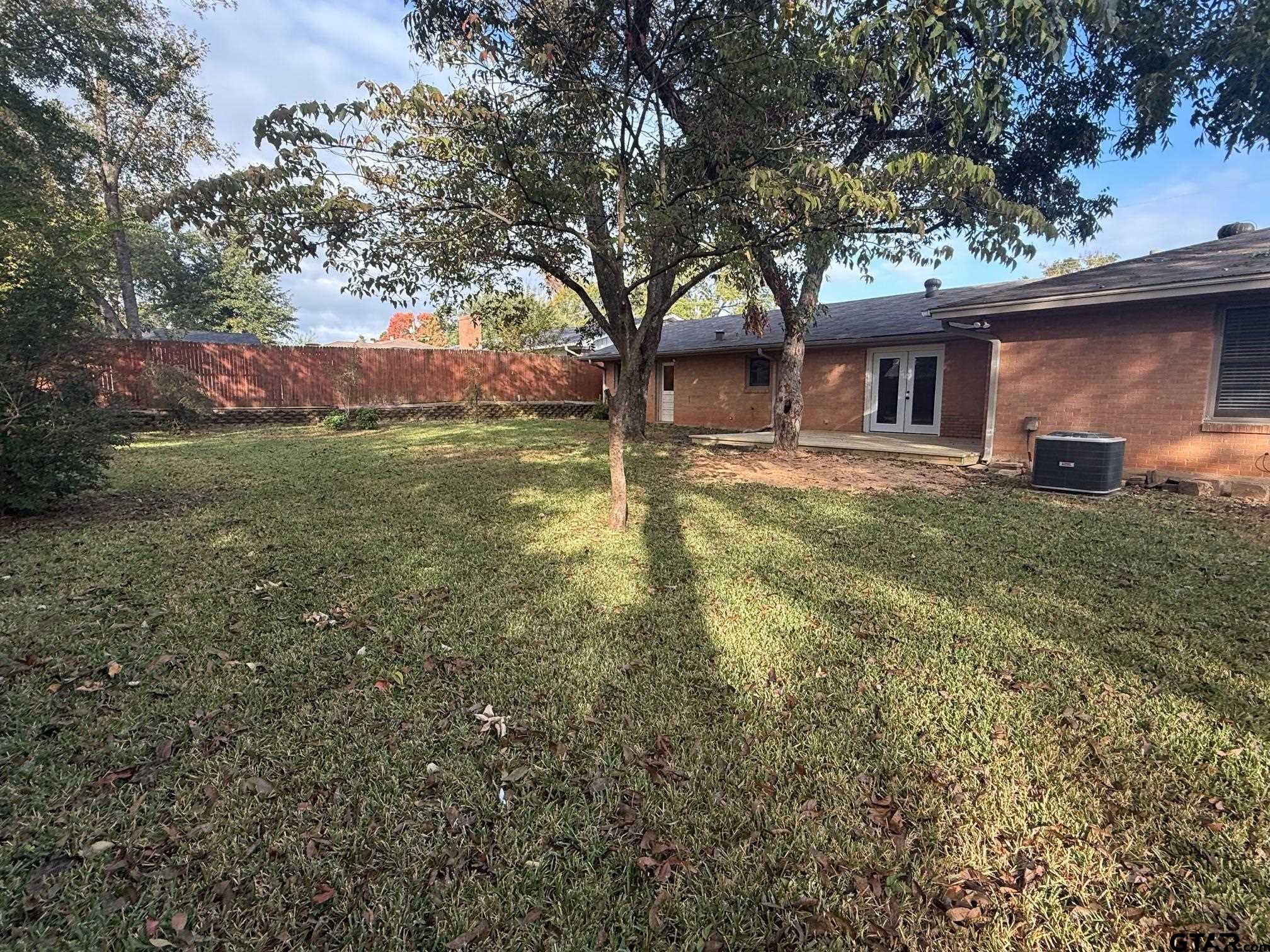 301 Ridgecrest Drive Tyler, TX 75701 - Photo 26 of 27 a view of a house with a yard