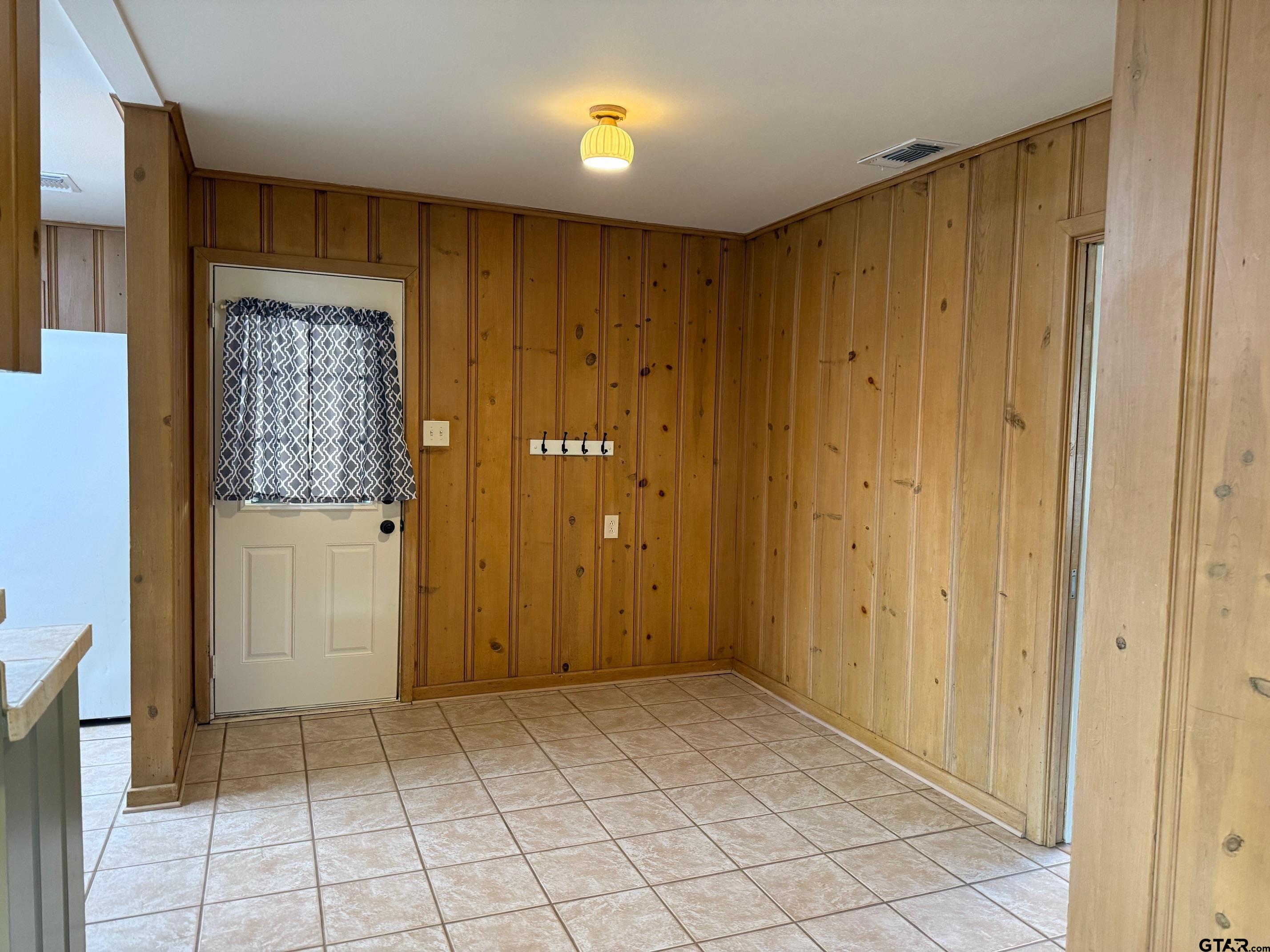 301 Ridgecrest Drive Tyler, TX 75701 - Photo 7 of 27 a view of an empty room with window and cabinet
