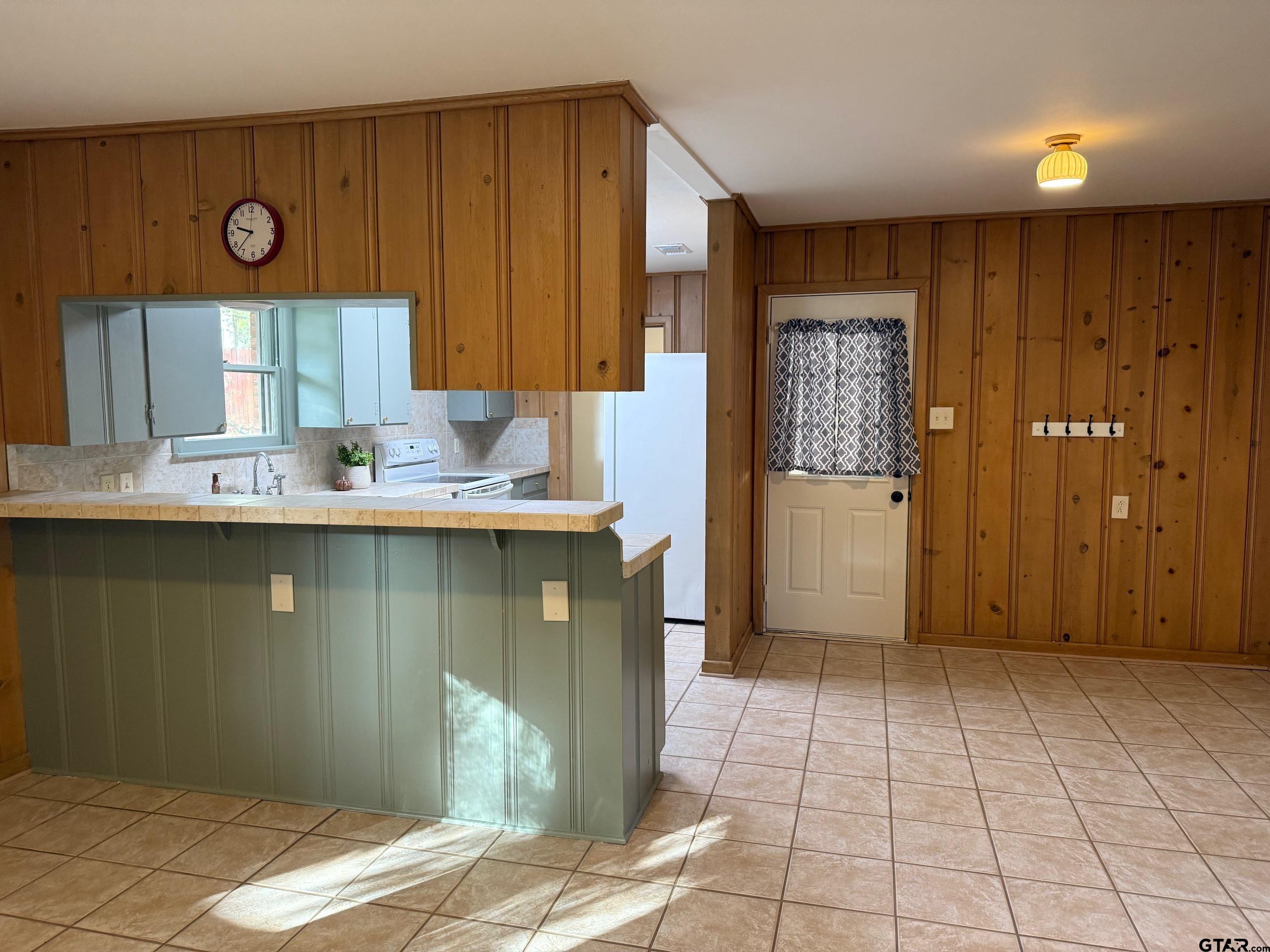 301 Ridgecrest Drive Tyler, TX 75701 - Photo 8 of 27 a kitchen with stainless steel appliances granite countertop a refrigerator and a sink