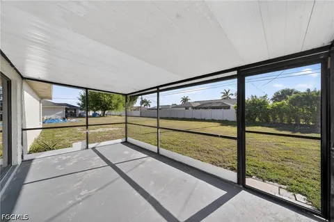 a view of en suite bathroom with a large window and garden view