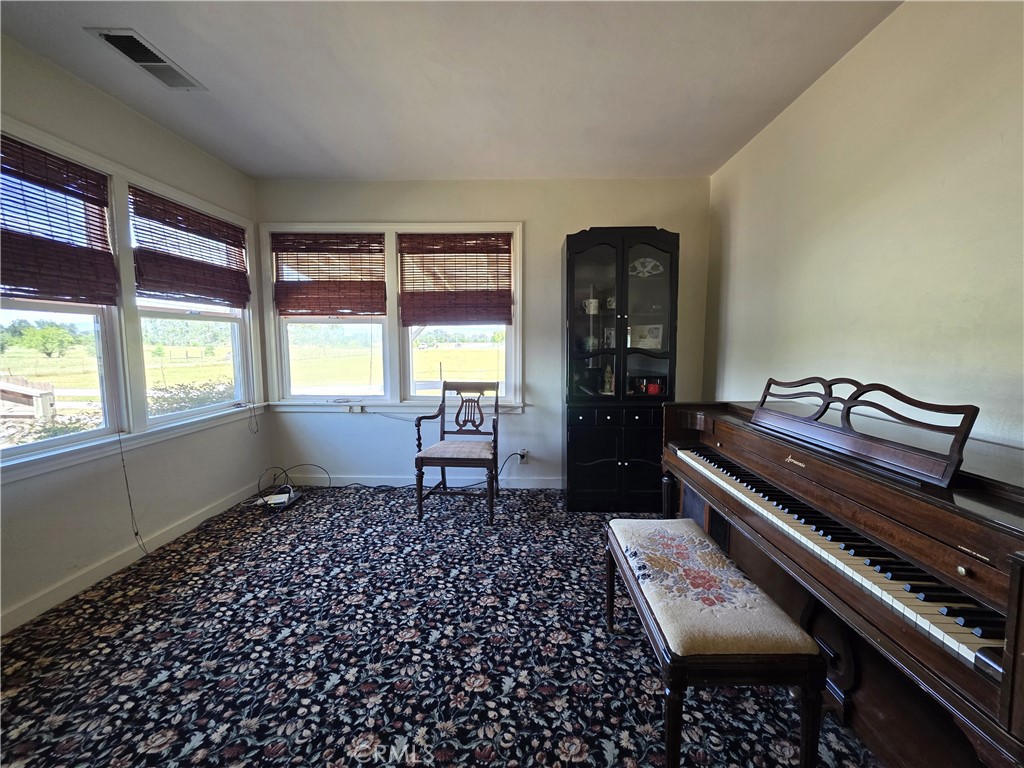 23773 River Road Corning, CA 96021 - Photo 17 of 64 a living room with furniture and a window