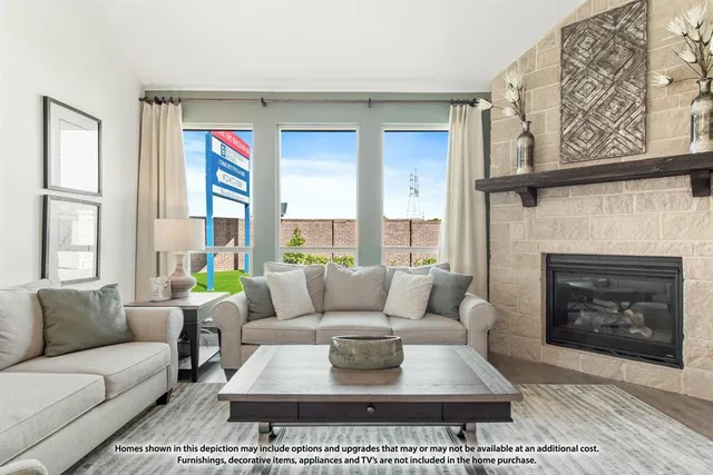a living room with furniture a rug and a fireplace