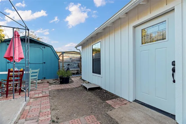 a view of a tree in the middle of a yard