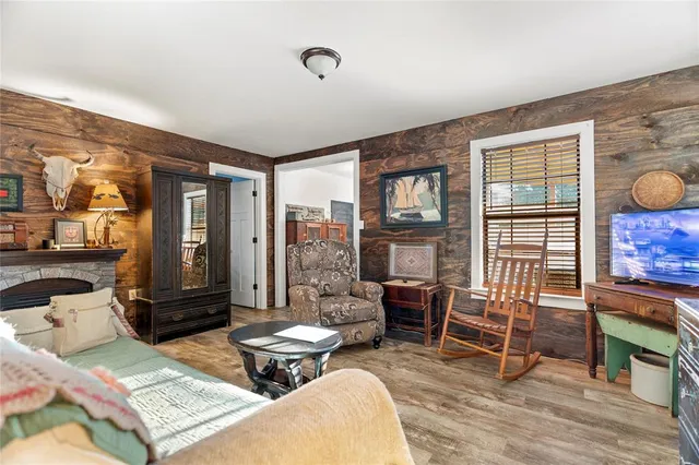 a room with stainless steel appliances kitchen island granite countertop furniture and a dining table