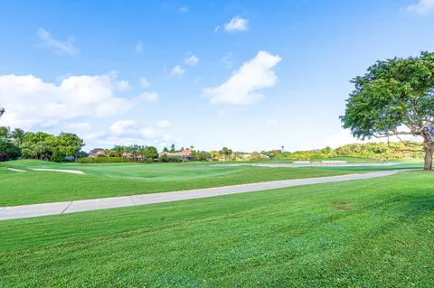 a swimming pool with trees in the background