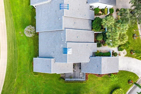 an aerial view of a swimming pool patio fire pit and outdoor seating