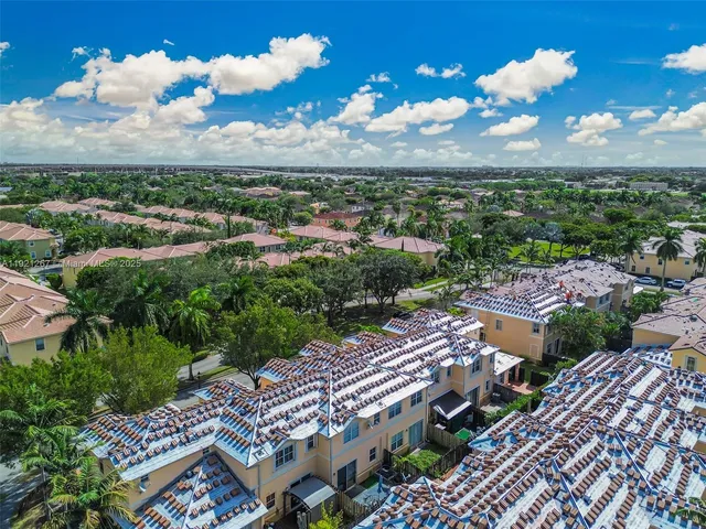a view of car parked on street side of building