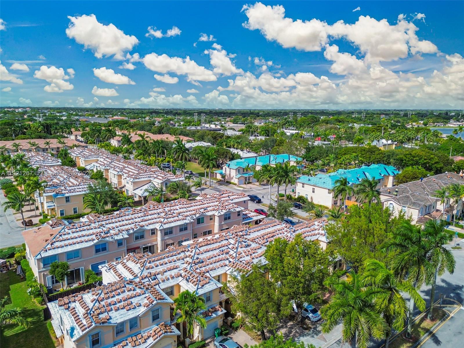 12230 Southwest 123rd Pass Miami, FL 33186 - Photo 21 of 64 an aerial view of a city with lots of residential buildings ocean and mountain view in back