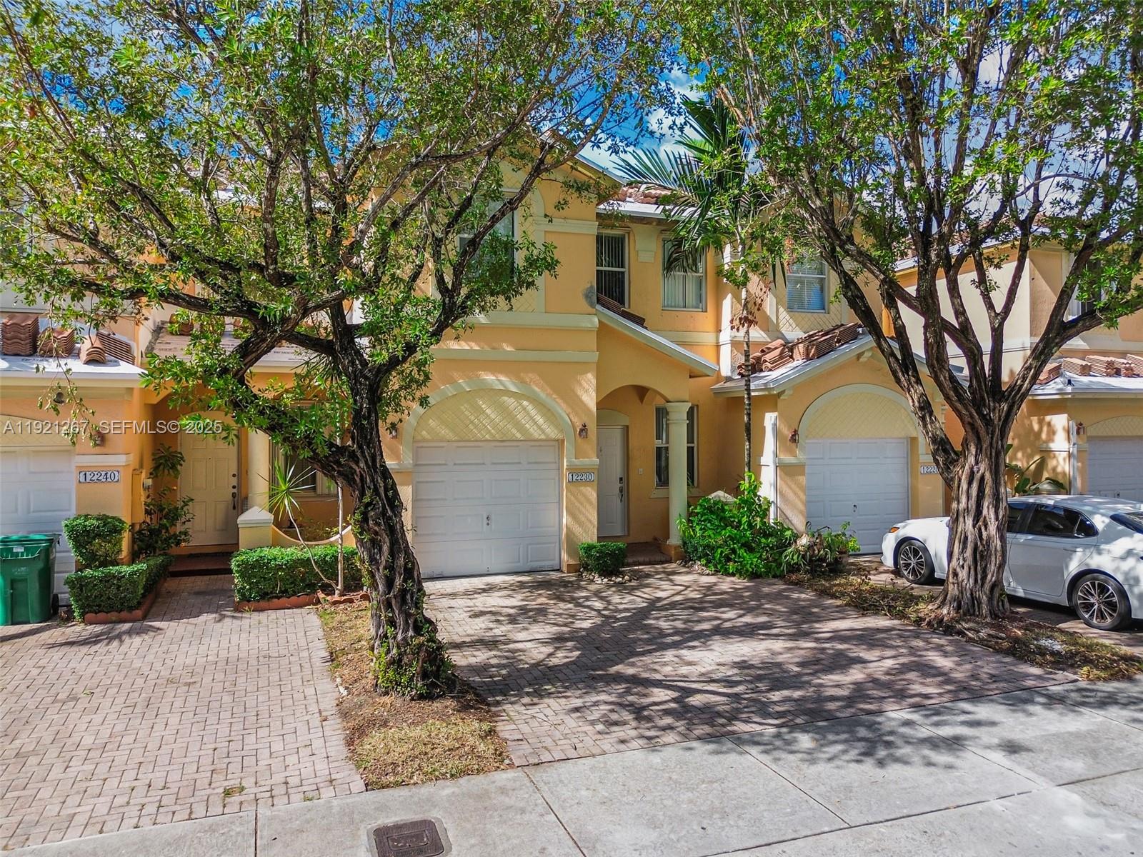 12230 Southwest 123rd Pass Miami, FL 33186 - Photo 26 of 65 a front view of a house with garden