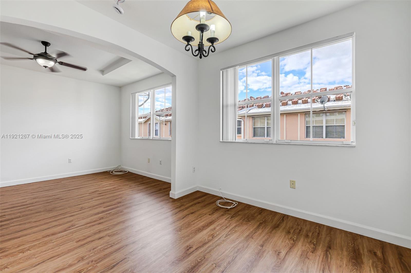 12230 Southwest 123rd Pass Miami, FL 33186 - Photo 45 of 64 wooden floor in an empty room with a window