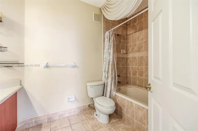 a view of a palm trees front of house