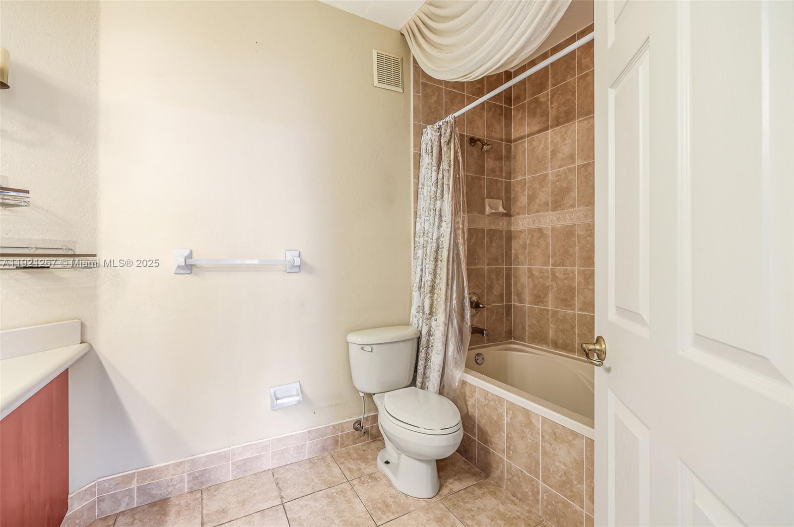 12230 Southwest 123rd Pass Miami, FL 33186 - Photo 47 of 64 a bathroom with a toilet and shower