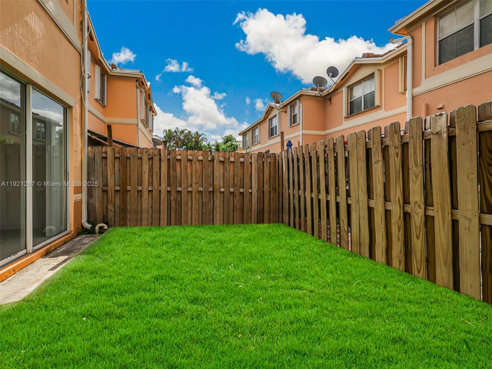 12230 Southwest 123rd Pass Miami, FL 33186 - Photo 56 of 64 a view of a back yard of the house