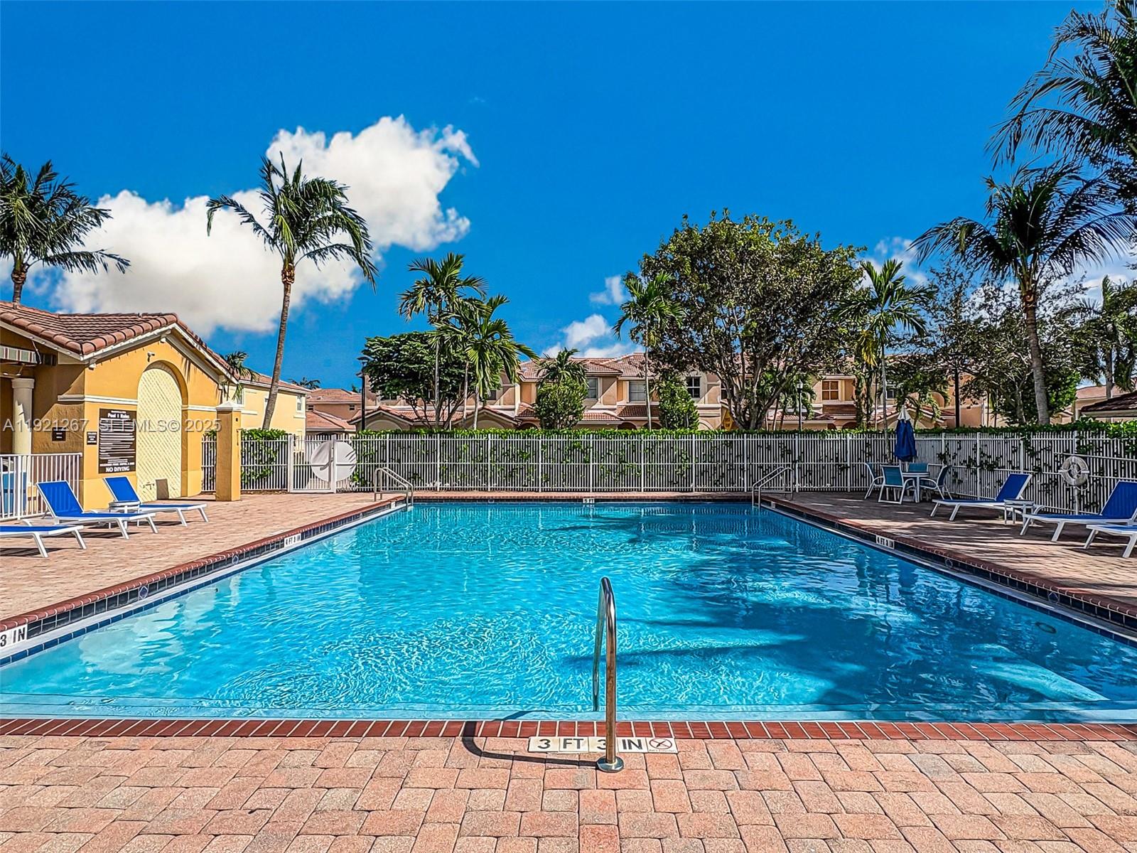 12230 Southwest 123rd Pass Miami, FL 33186 - Photo 6 of 65 a view of a swimming pool with an outdoor space