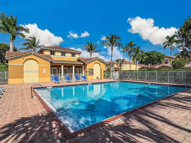 a view of swimming pool with a patio