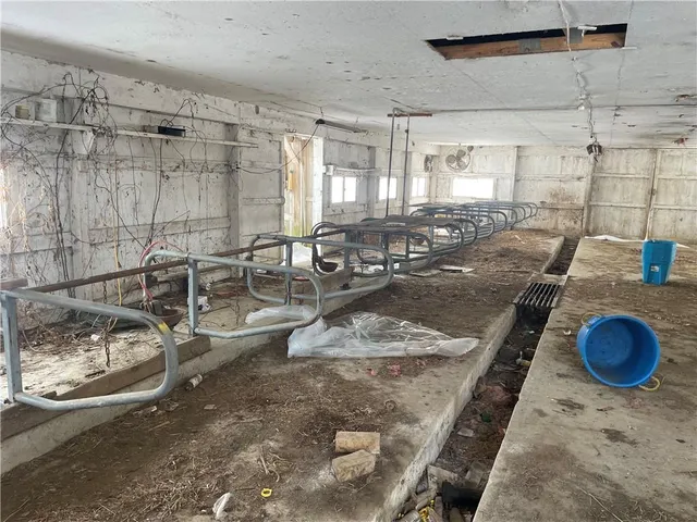 a living room with lots of furniture and a rug