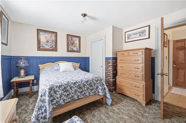 a bedroom with a bed and furniture