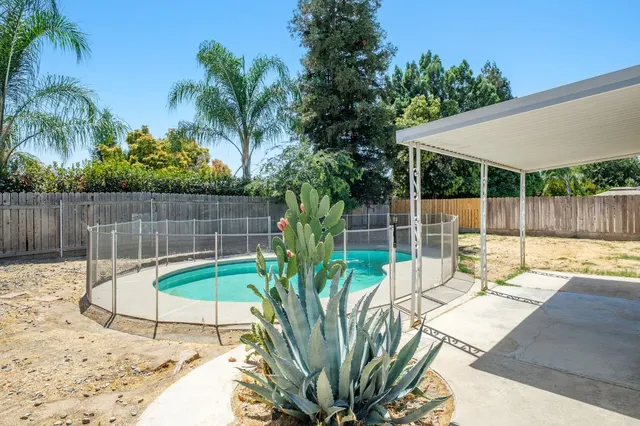 a view of a backyard with a patio